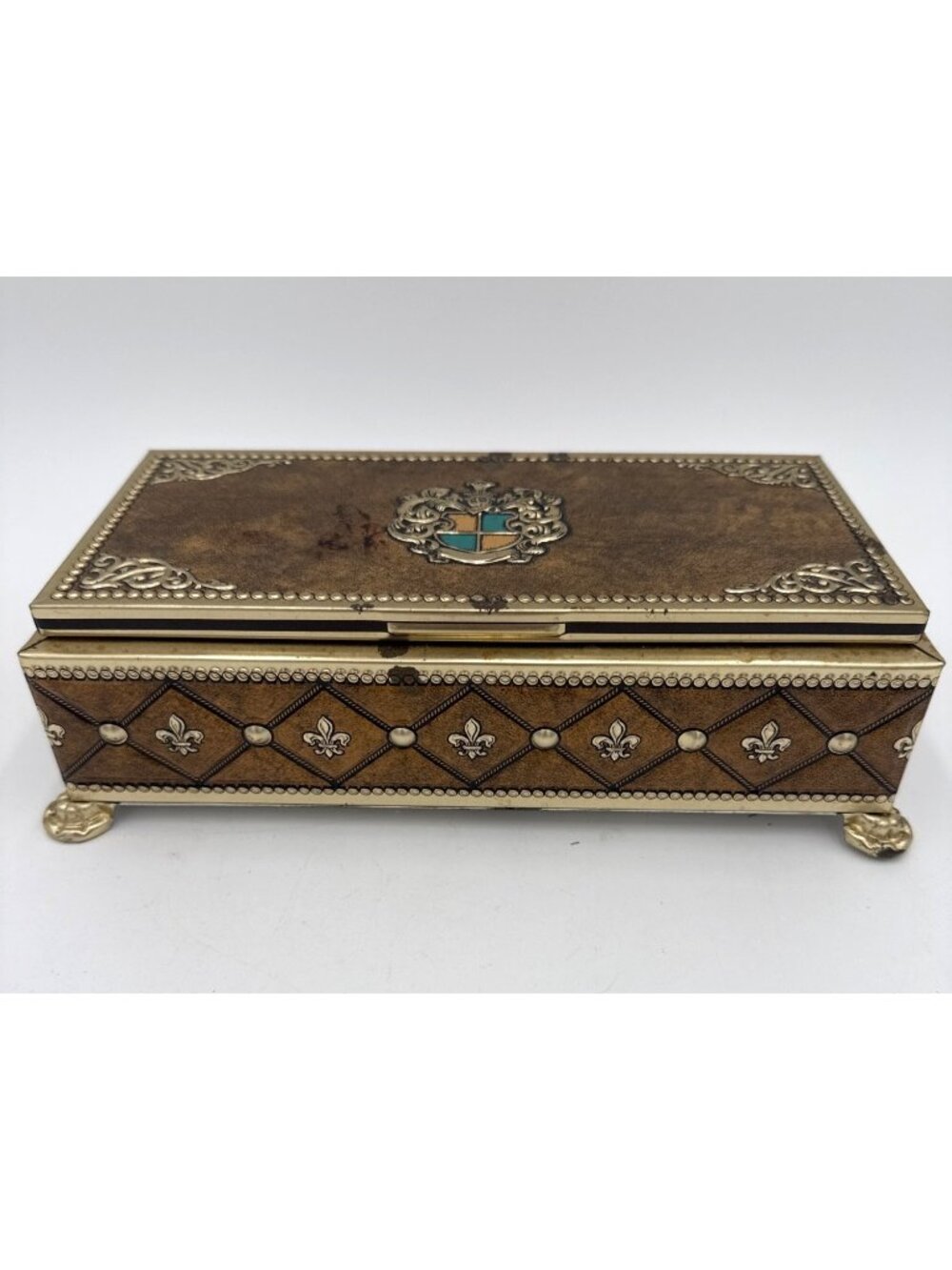 Vtg Ornate Metal Jewelry Box Crest Design Gold & Silver Tones Footed Base